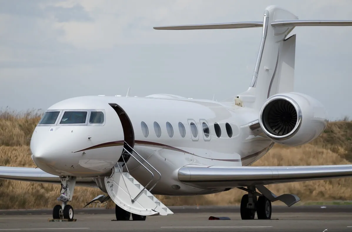 A Gulfstream business jet on the ramp with its airstair down