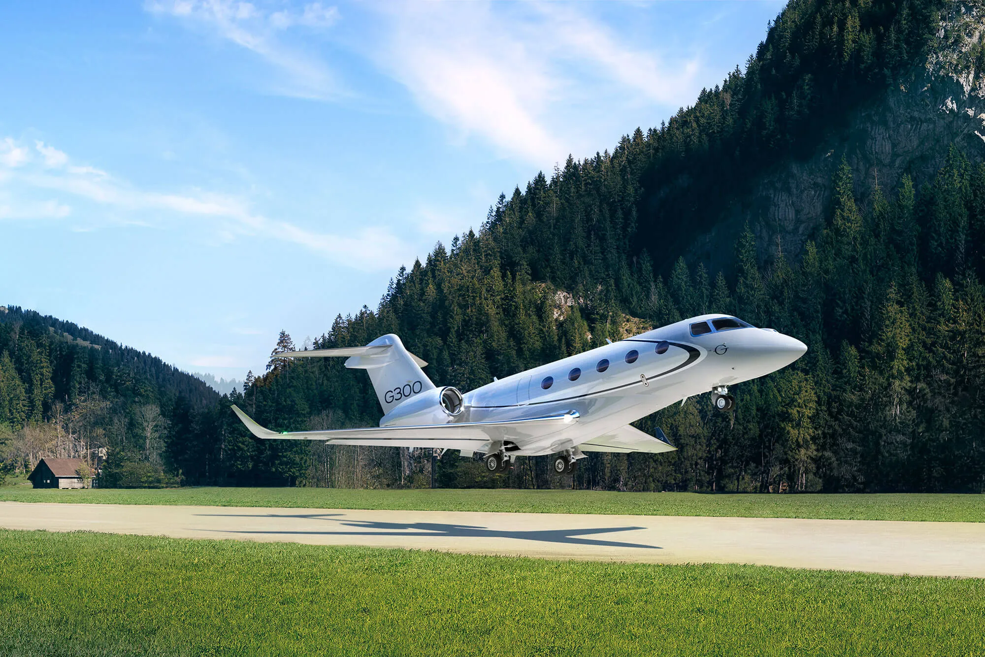 A private jet in flight over a mountain valley